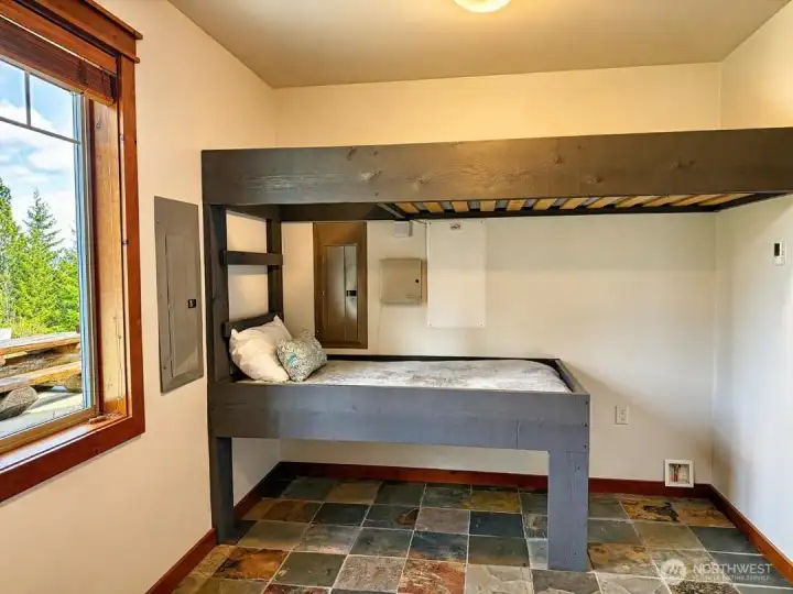 4th sleeping area is just that, on the opposite wall is the laundry room - so not fully a bedroom, but it does have a door, window and area for cloths. Just is not a full separate bedroom if that is what you needed.