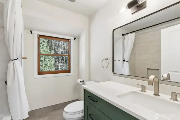 Beautifully updated main bathroom with contemporary finishes. Beautifully updated main bathroom with contemporary finishes.