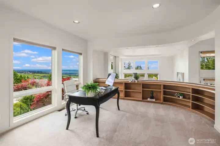 Generously sized office with walls of built-in shelves awaiting your book collection Generously sized office with walls of built-in shelves awaiting your book collection
