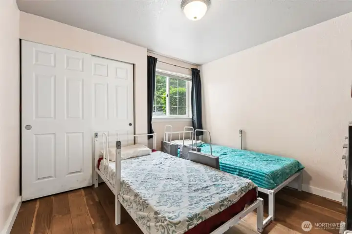 Third bedroom with a large window for natural light, and a spacious closet with sliding doors. Third bedroom with a large window for natural light, and a spacious closet with sliding doors.
