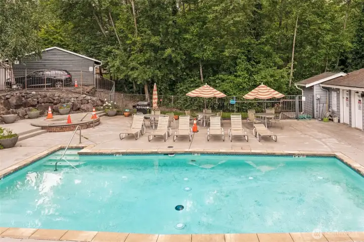 Enjoy amenities with a beautifully maintained outdoor pool, spacious sun deck, lounge chairs, and picnic tables with umbrellas. Surrounded by mature trees, this inviting community space is perfect for relaxing, entertaining, and making the most of warm summer days. Enjoy amenities with a beautifully maintained outdoor pool, spacious sun deck, lounge chairs, and picnic tables with umbrellas. Surrounded by mature trees, this inviting community space is perfect for relaxing, entertaining, and making the most of warm summer days.