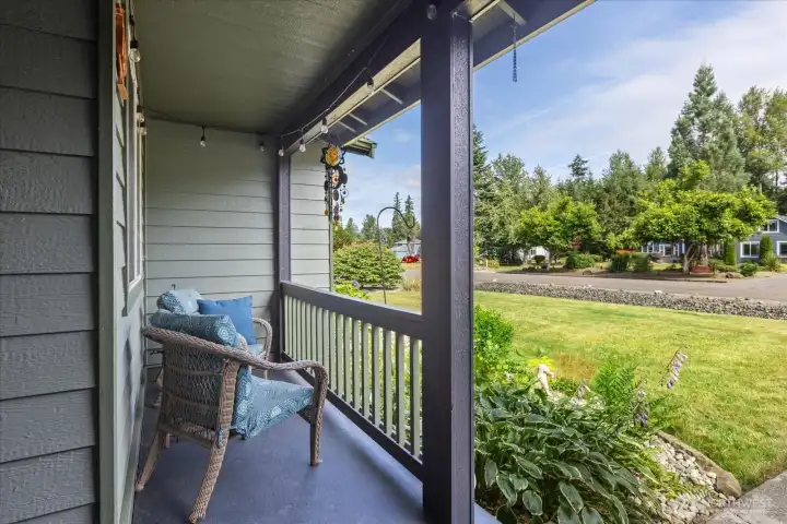 Enjoy your morning coffee or unwind in the evening from the comfort of the covered front porch.