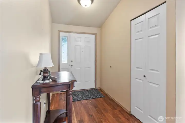 A welcoming foyer with vaulted ceilings provides an inviting first impression the moment you step inside.