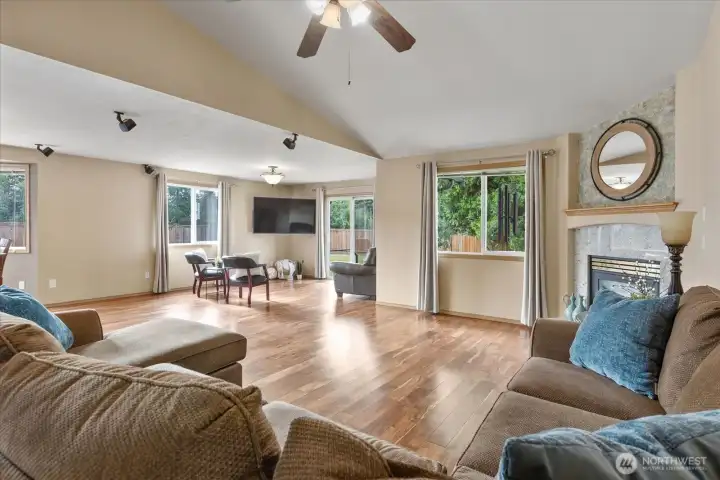 Vaulted ceilings and Acacia hardwood floors create an inviting space designed for both everyday living and effortless entertaining.