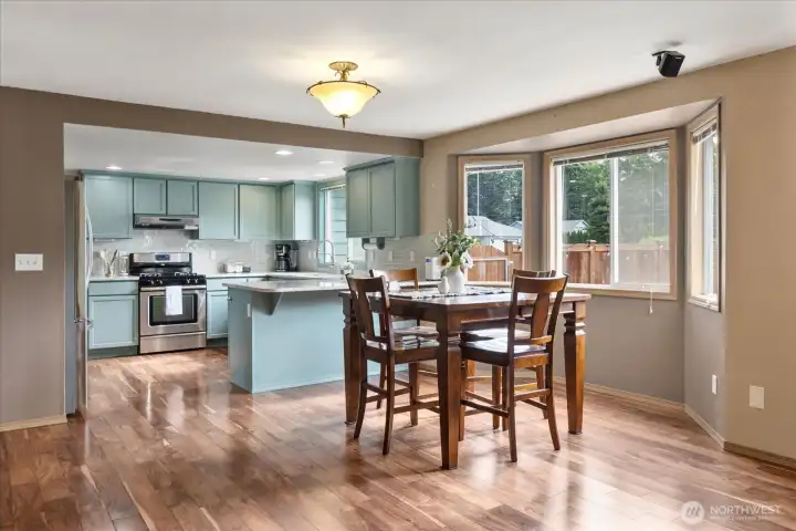 The open dining area flows seamlessly into the remodeled kitchen, making meals and entertaining feel effortless.