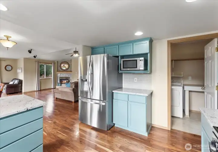 Conveniently located laundry room just off the kitchen with additional storage and easy access to the main living spaces.