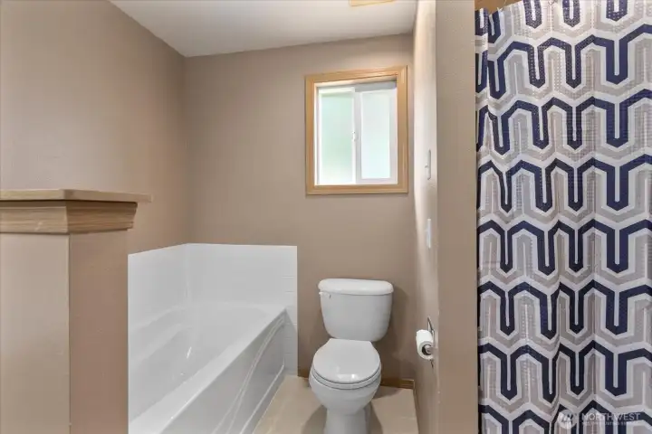 A full bath with tub and shower provides comfort and functionality for everyday living.