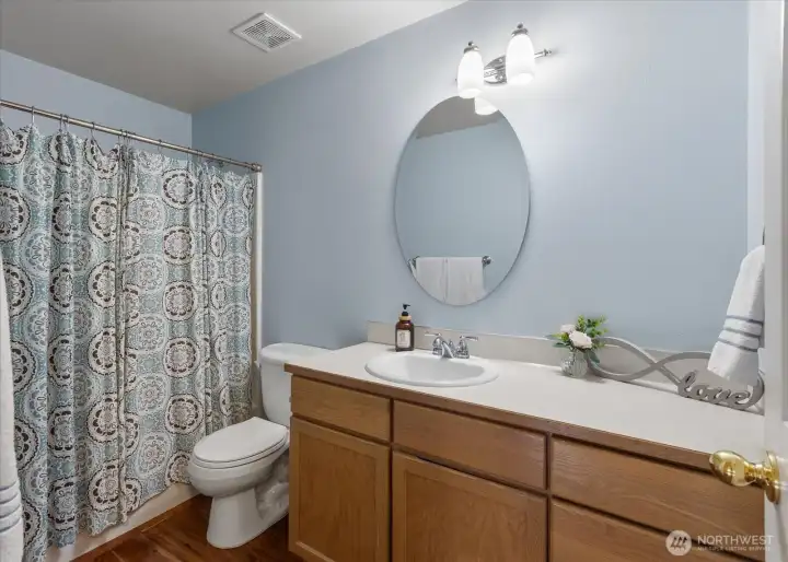 Full bathroom with ample vanity space and a clean, functional layout.