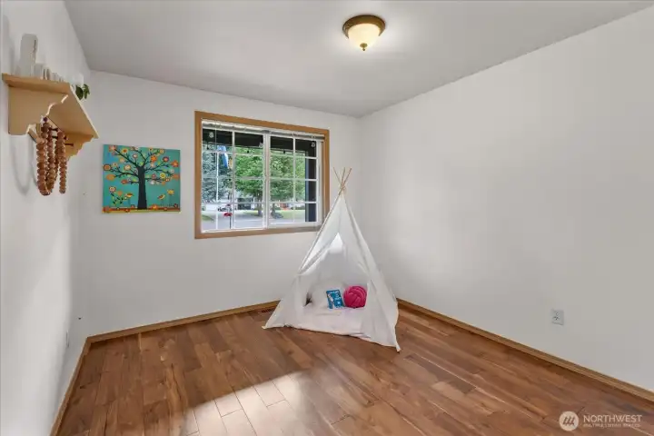 Filled with natural light, this secondary bedroom creates a warm and comfortable space for everyday living.