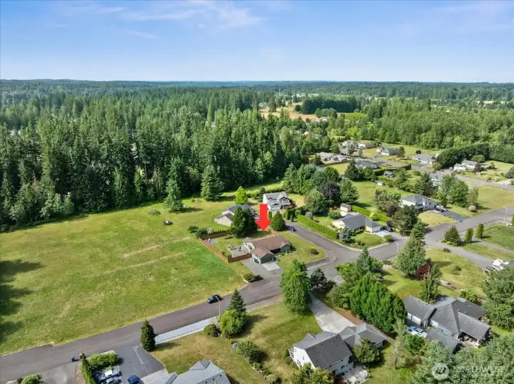 Surrounded by mature evergreens and open green space, the setting offers a wonderful sense of privacy and tranquility.