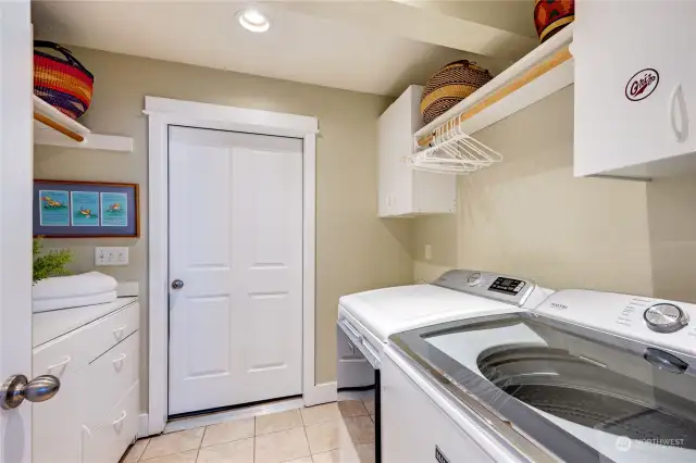 laundry adjacent to mud room and hot tub