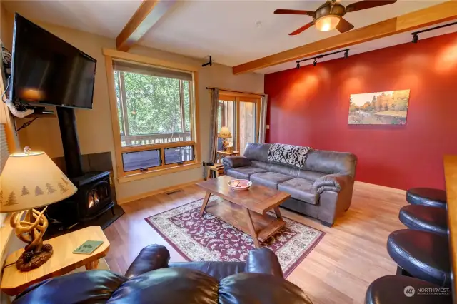 Wood details throughout, wood sliding door leading to the covered porch and river views.