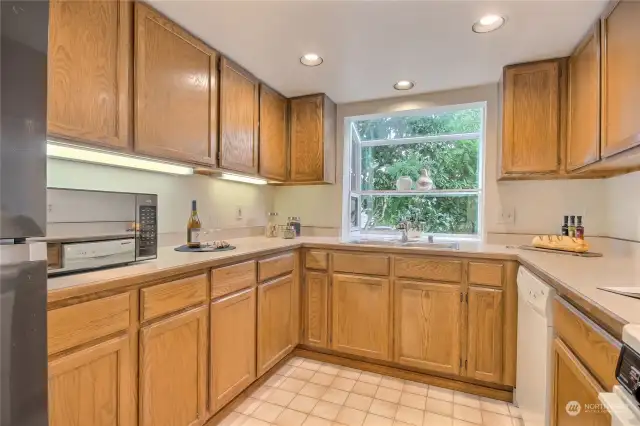 Spacious kitchen with garden window.