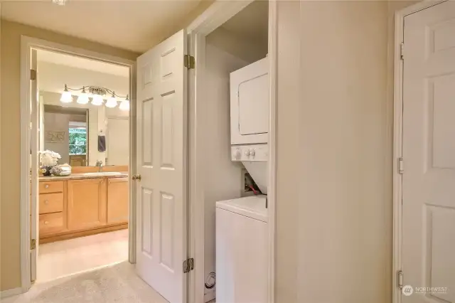 Stacking washer and dryer in home.