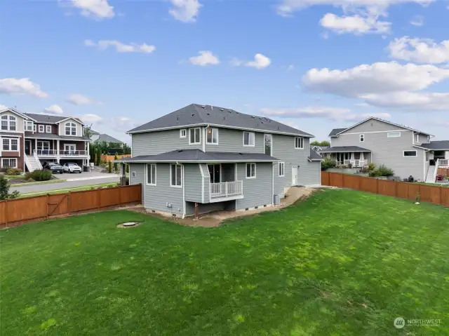 Back yard is lightly sloped and fully fenced.