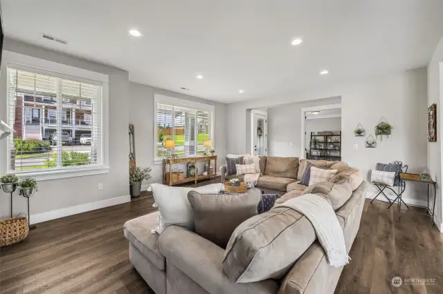 No shortage of windows in this home design! Custom wood blinds included.