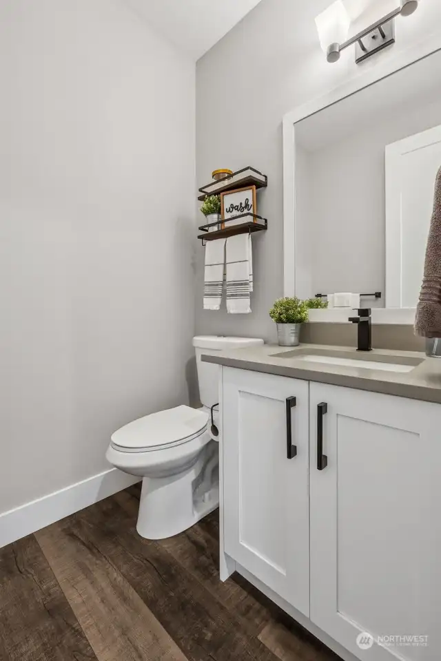 Convenient powder room on main. NOTE: Original builder plans included space to convert to 3/4 bathroom.