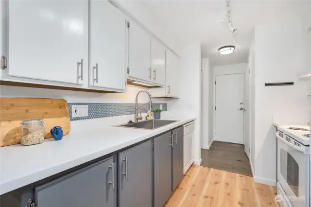 The garage is right off the kitchen, which makes for easy unloading after trips to the nearby grocery stores. There are multiple options close by!