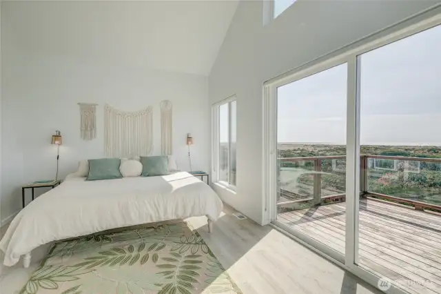 Primary suite and view of deck.