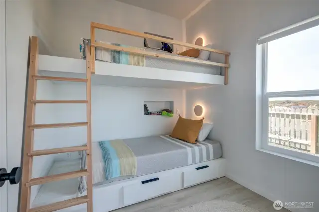 Third bedroom with built in bunk beds and closet.