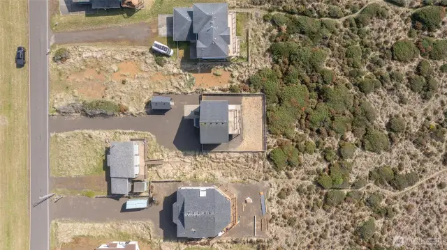 Birds-eye view of the house showing trails to beach.