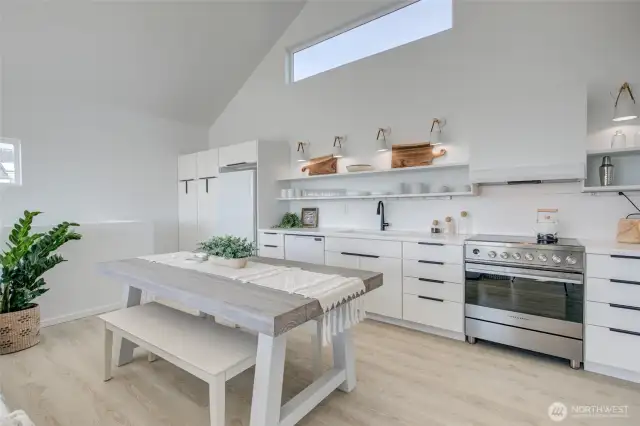 Dining area and kitchen with plenty of storage for all your cookware and kitchen staples.