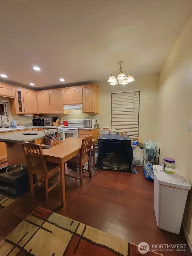 Kitchen with eating area ... and inside furry family member kennel.