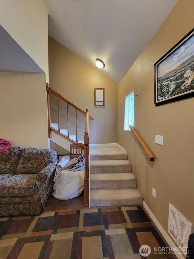 Staircase from living room to upper level.