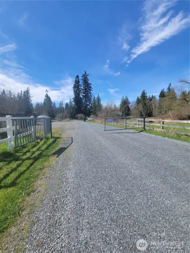 Three home gated community at the end of a long dead end road .... but just two miles west of I-5. No thru traffic.