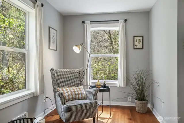 Expansive windows throughout offer unobstructed views of the tranquil outdoors, bringing nature’s beauty inside while maintaining complete privacy.