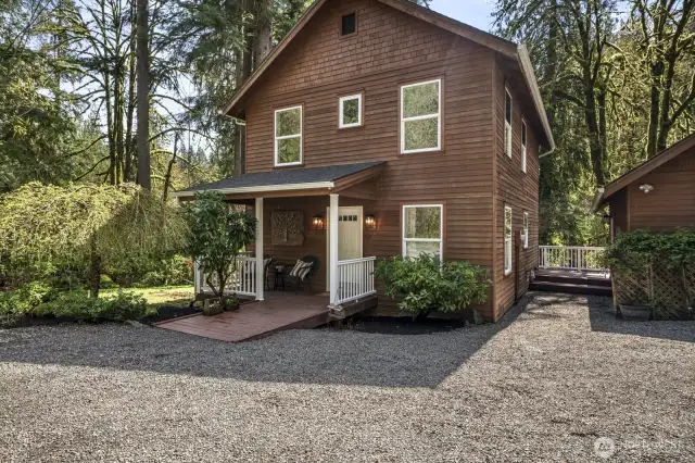 A welcoming covered front porch and spacious back deck offers seamless indoor-outdoor living and connects directly to the detached garage—perfect for easy access and entertaining alike.