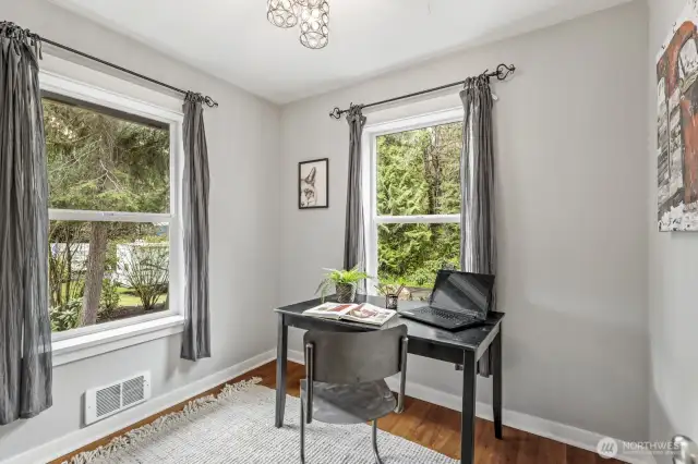 The third bedroom offers flexible space, perfect for use as a den or home office.