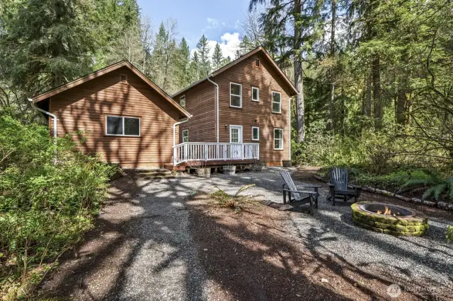 Set on a serene half-acre, the home is surrounded by natural beauty and a lush, green yard—offering space to roam, garden, or simply enjoy the peaceful outdoor setting.