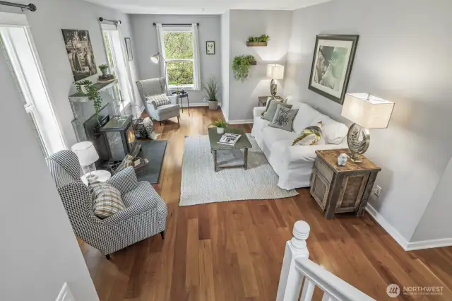 Rich cherry hardwood floors flow through most of the main living space, adding warmth and character.