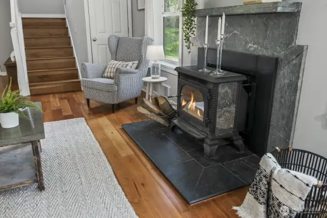 A charming wood-burning stove in the living area adds to a cozy and welcoming atmosphere.