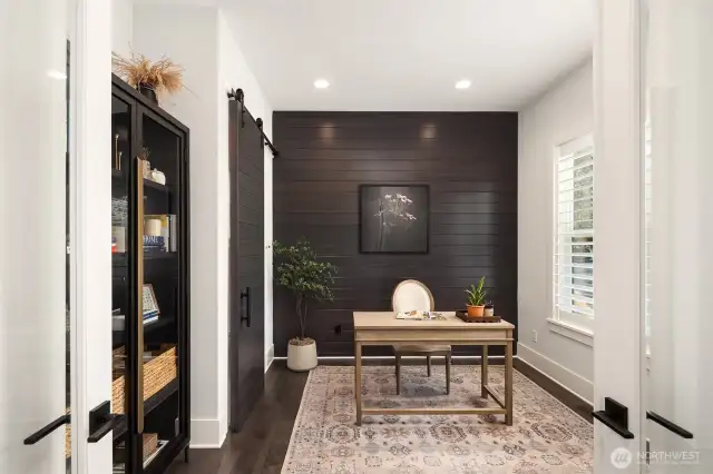 A versatile office space—easily convertible to a guest suite—complements the main level along with an adjacent three-quarter bath, providing single-level living when desired.