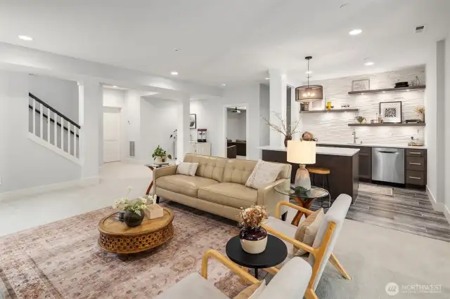 The lower level elevates everyday living with entertainment spaces par excellence—featuring a fully equipped bistro kitchen, expansive flex space, dedicated theater room, and two additional bedrooms. This thoughtfully designed level creates endless possibilities for hosting, multi-generational living, or work-from-home arrangements.