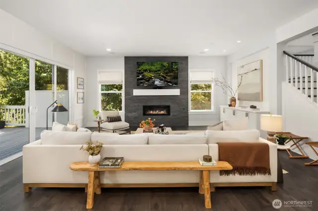 The architecture presents an extraordinary balance of open concept living and purposeful spaces across three meticulously designed levels.