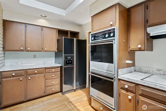 Kitchen with nice spaces and potential. Original oak hardwoods!