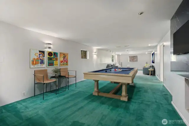 Recreation room includes a fireplace & wet bar for hours of entertaining! Virtually staged to show potential of this space!