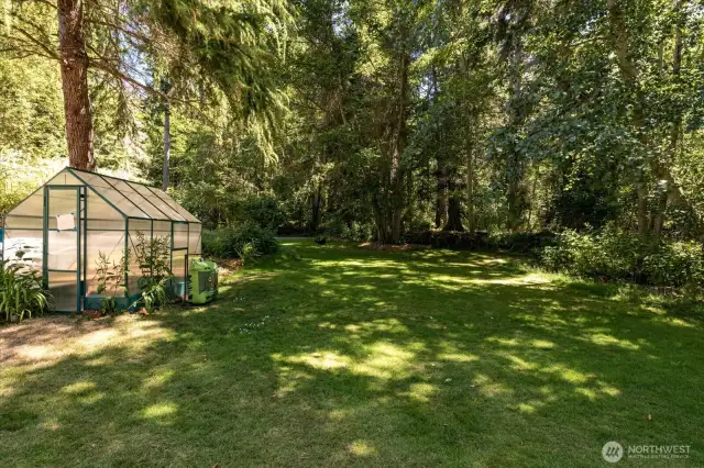 (Greenhouse does not convey) Neatly manicured lawn and local flora create a very private, calm, and peaceful feeling the moment you step onto the property.