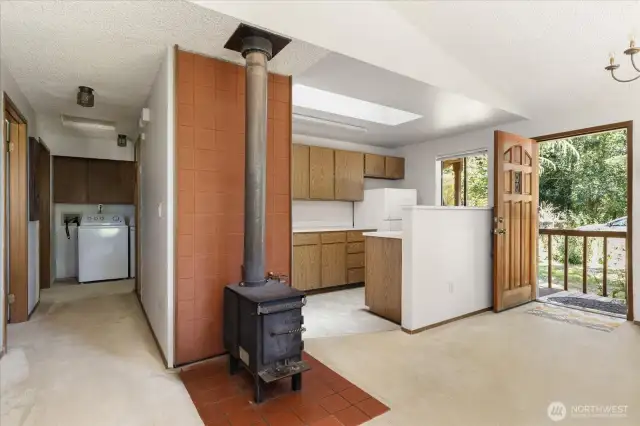 Wood burning stove for cozy evenings by the fire. *Tenant's furnishings have been digitally removed.*