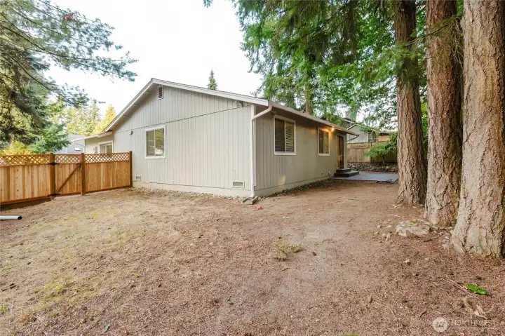 The back yard is huge and is fenced