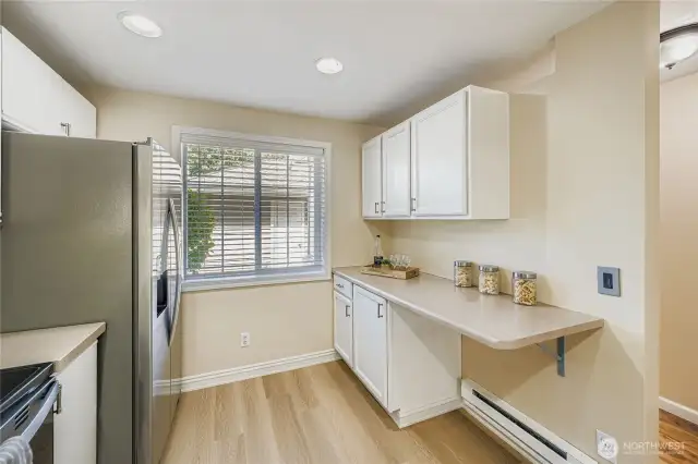 Spacious kitchen with ample counter space and new floors!