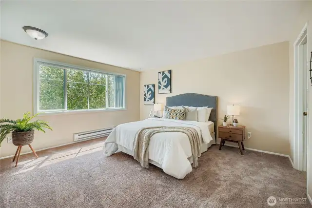 Spacious Primary bedroom with plenty of natural light!