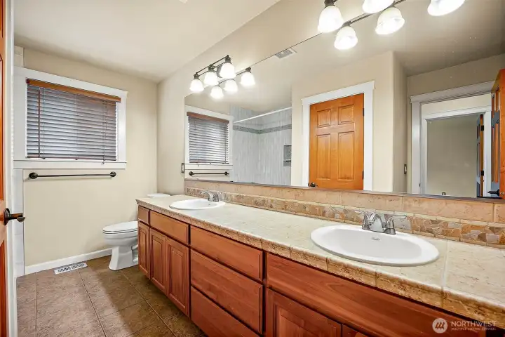 Upstairs full bath with double-sink vanity and huge mirror