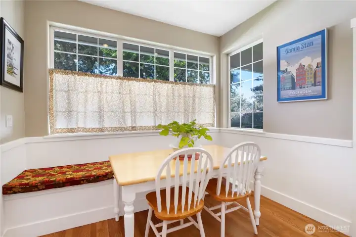 Bright dining area overlooking backyard and patio space
