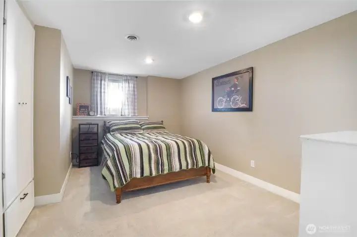 Spacious bedroom with neutral tones ready for personal style