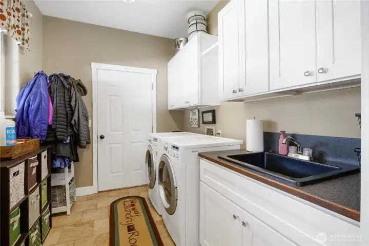 Functional laundry room with storage and utility sink