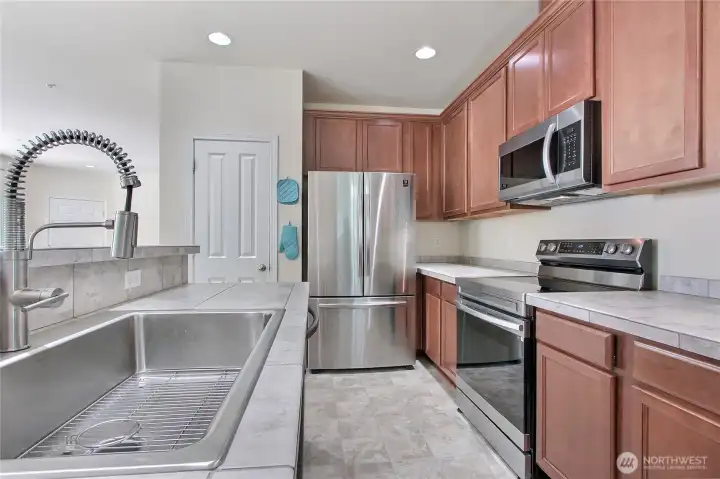 Kitchen has a wonderful farm sink, pantry and lots of counter space.